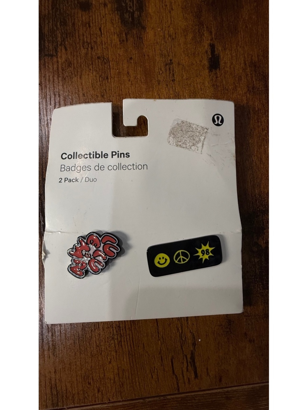 Lululemon Collectible Pins 2-Pack with Peace, Smile, and 'Lululemon' Logo Design